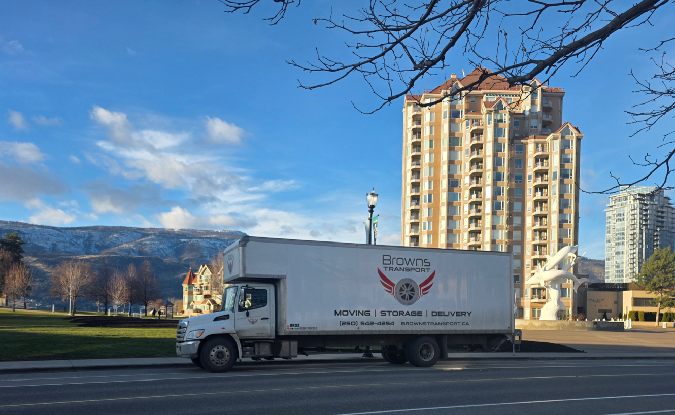 Browns Transport moving truck parked in downtown Kelowna, BC, offering local and long-distance residential moving services.